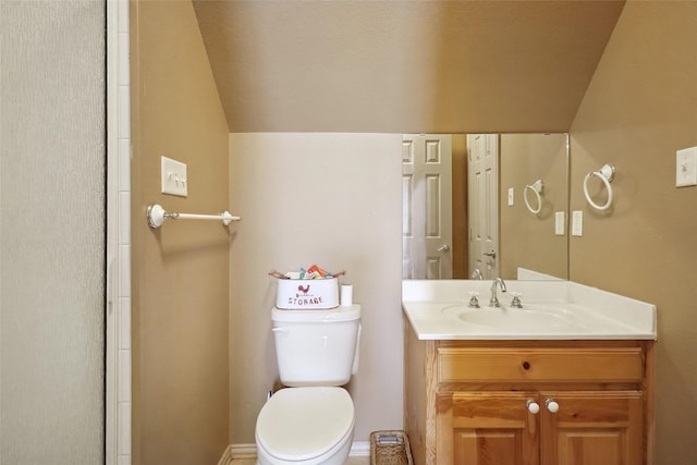 bathroom featuring toilet and vanity