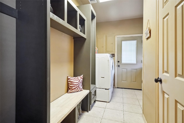 mudroom featuring washer / dryer and light tile patterned floors