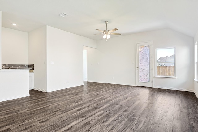 unfurnished living room featuring ceiling fan and dark hardwood / wood-style flooring