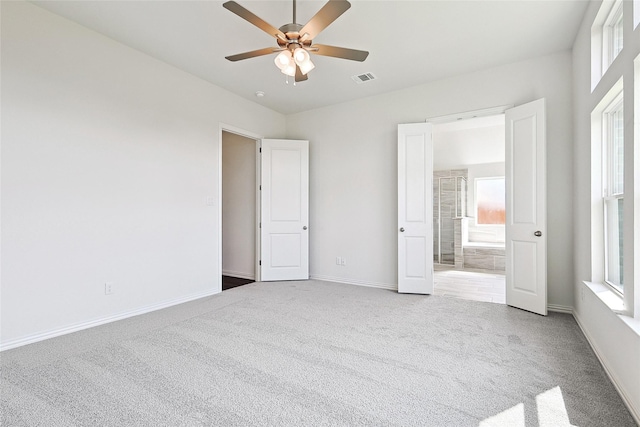 unfurnished bedroom with carpet flooring and ceiling fan