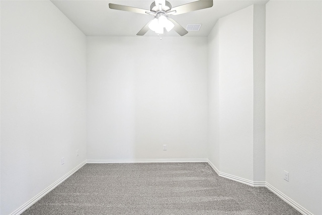 unfurnished room featuring ceiling fan and carpet floors