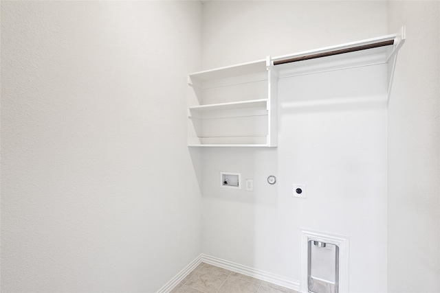 clothes washing area with hookup for a washing machine, gas dryer hookup, and electric dryer hookup