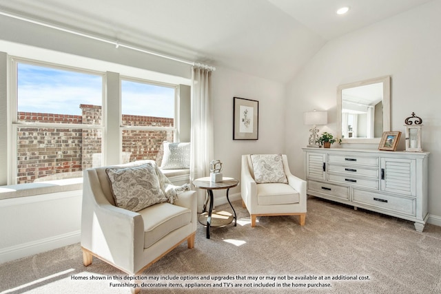 living area with vaulted ceiling and light colored carpet