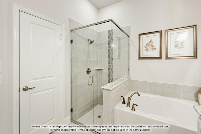 bathroom with separate shower and tub