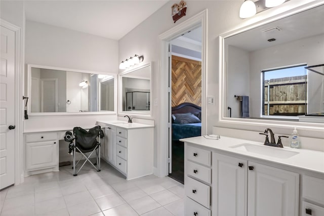 bathroom featuring tile patterned flooring and vanity