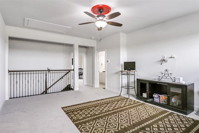 interior space with carpet flooring and ceiling fan