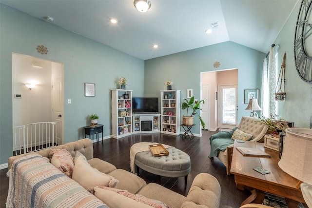 living room featuring vaulted ceiling and dark hardwood / wood-style flooring