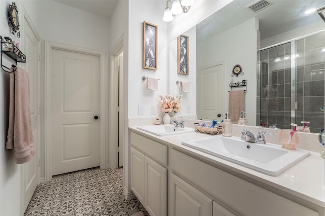 bathroom featuring double sink vanity and tile patterned flooring