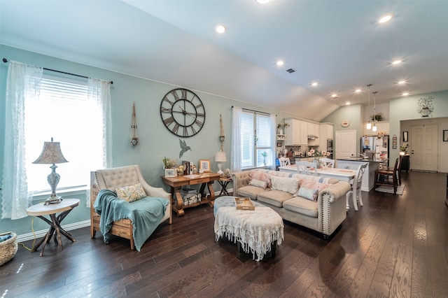 living room featuring dark hardwood / wood-style flooring and lofted ceiling