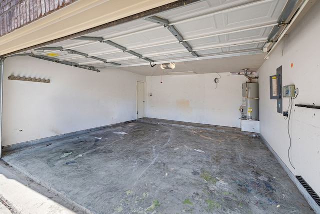 garage with a garage door opener and water heater