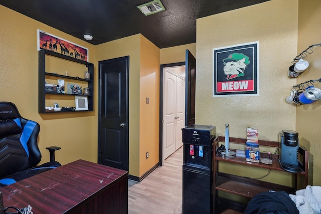 office space with light hardwood / wood-style flooring