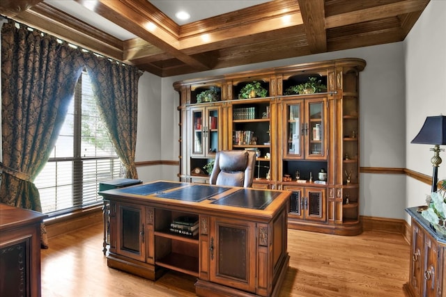 office space featuring light hardwood / wood-style floors, ornamental molding, beamed ceiling, and coffered ceiling