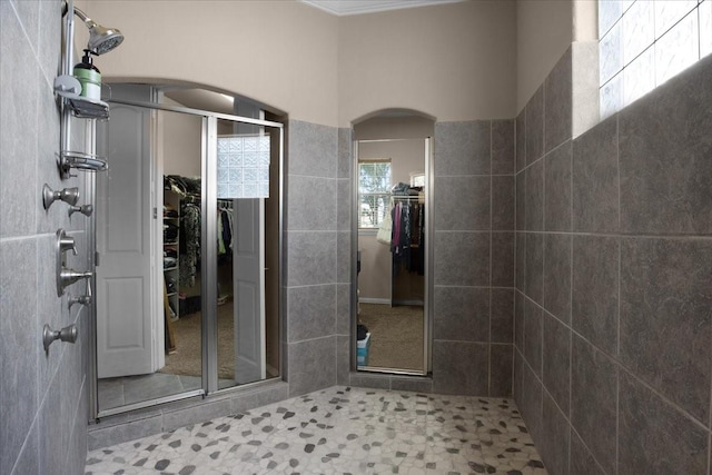 bathroom with tile patterned floors and an enclosed shower