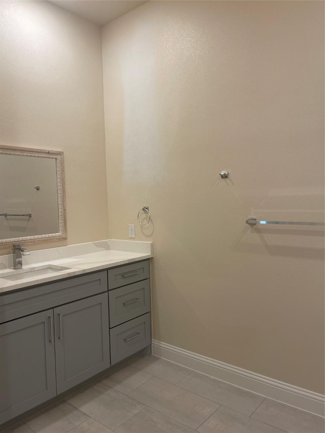 bathroom with vanity and tile patterned flooring