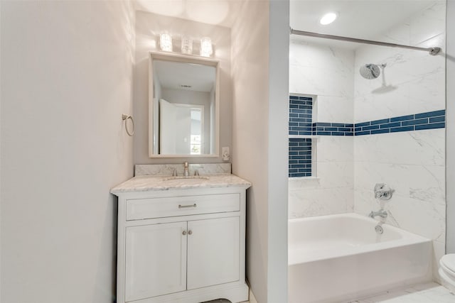 bathroom with  shower combination, marble finish floor, toilet, and vanity