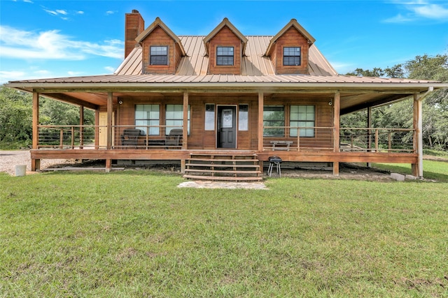 farmhouse-style home featuring a front lawn and covered porch