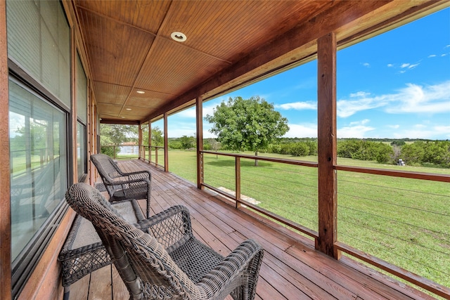 sunroom / solarium featuring wooden ceiling