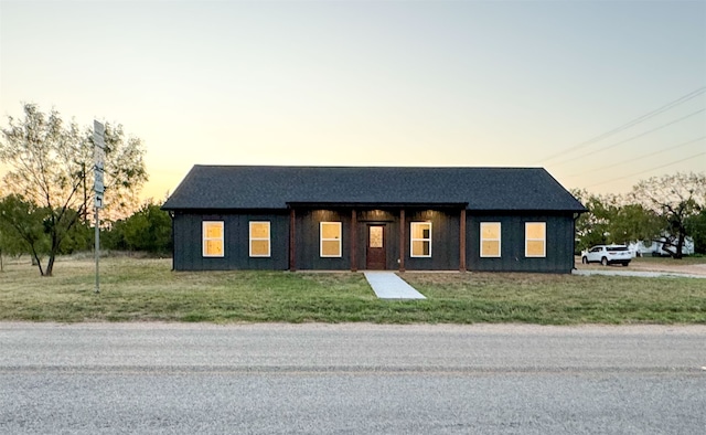 view of front of house with a lawn