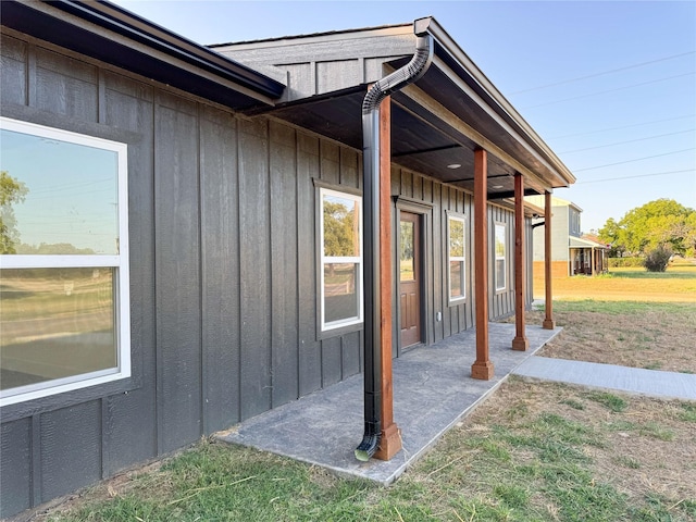 view of side of property featuring a patio area