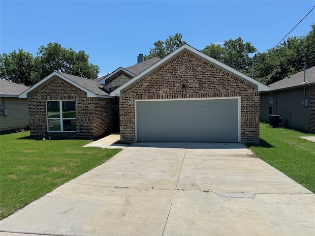 view of front of property with a garage, central AC, and a front yard