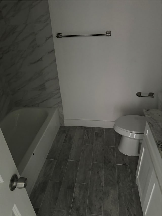 bathroom with toilet and vanity