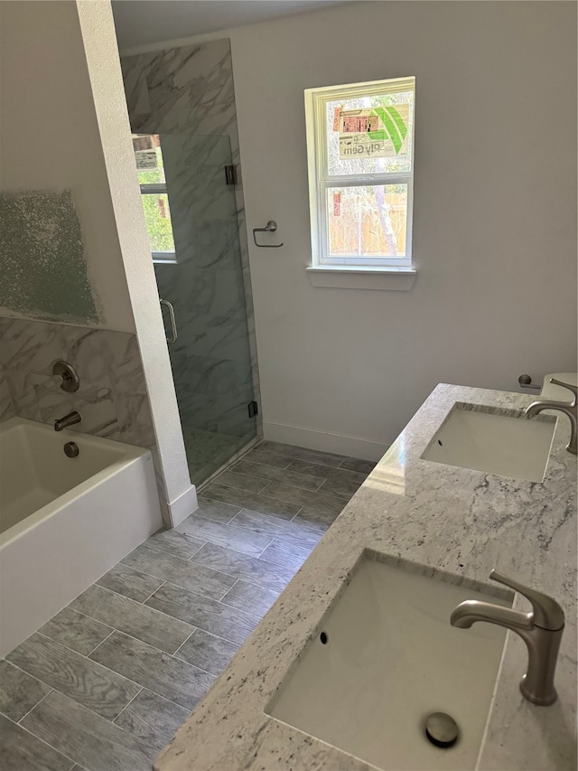 bathroom with separate shower and tub, tile patterned flooring, and double sink vanity