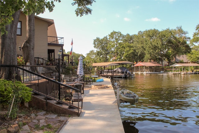 dock area with a water view