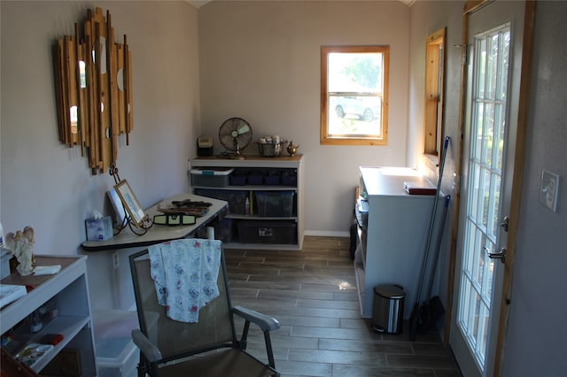 office space with dark wood-type flooring