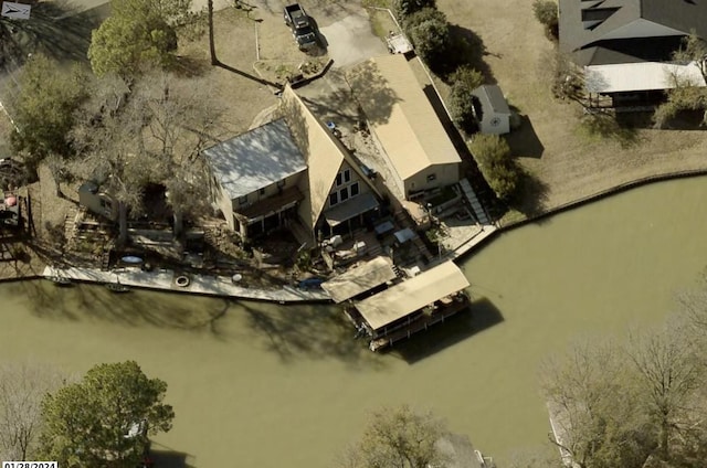 birds eye view of property featuring a water view