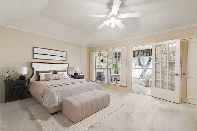 bedroom with lofted ceiling, crown molding, light colored carpet, a tray ceiling, and ceiling fan