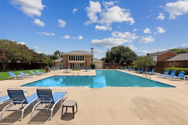 view of swimming pool with a patio area