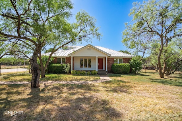 ranch-style home with a front yard