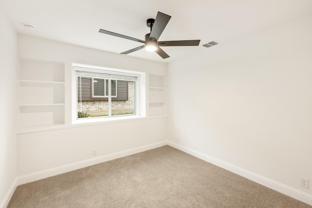 empty room featuring carpet and ceiling fan