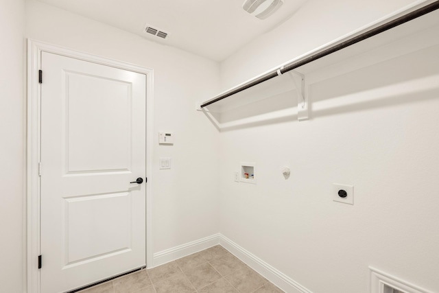 laundry area featuring washer hookup, electric dryer hookup, gas dryer hookup, and light tile patterned floors