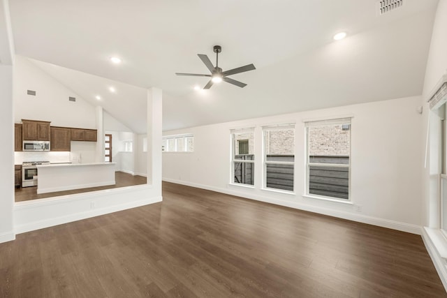 unfurnished living room with dark hardwood / wood-style floors, ceiling fan, and high vaulted ceiling