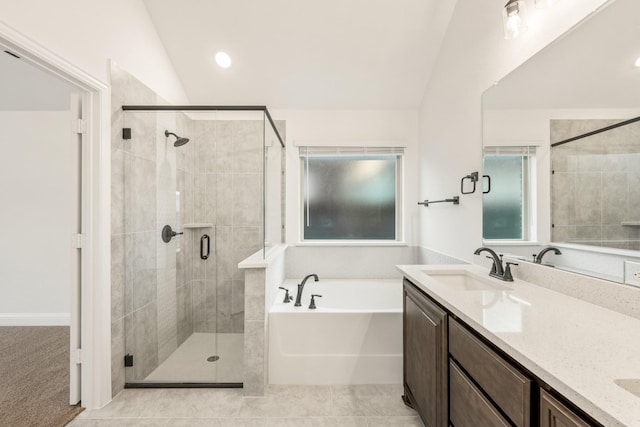 bathroom with tile patterned flooring, vanity, lofted ceiling, and plus walk in shower