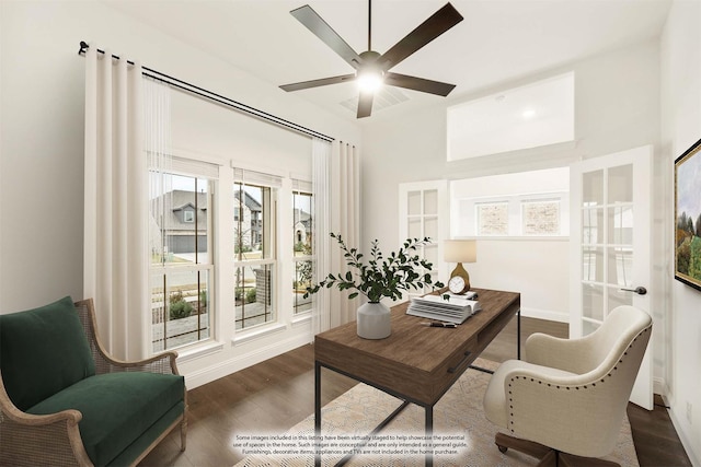 office space featuring ceiling fan, plenty of natural light, and dark wood-type flooring