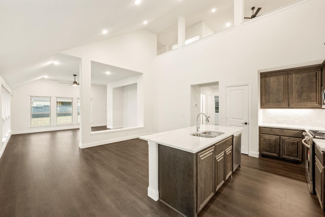 kitchen with sink, ceiling fan, an island with sink, dark hardwood / wood-style flooring, and stainless steel appliances