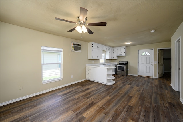 kitchen featuring electric range, white cabinetry, ceiling fan, and dark wood-type flooring