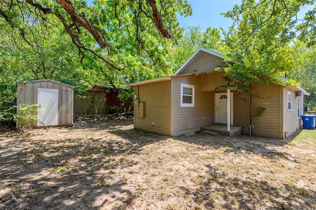 exterior space with a storage shed