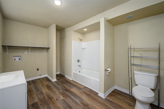 full bathroom featuring vanity, wood-type flooring, toilet, and  shower combination