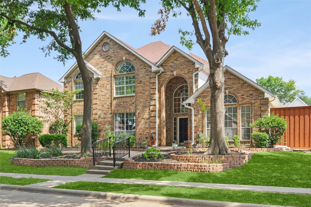 front facade with a front yard