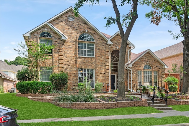 front facade with a front yard