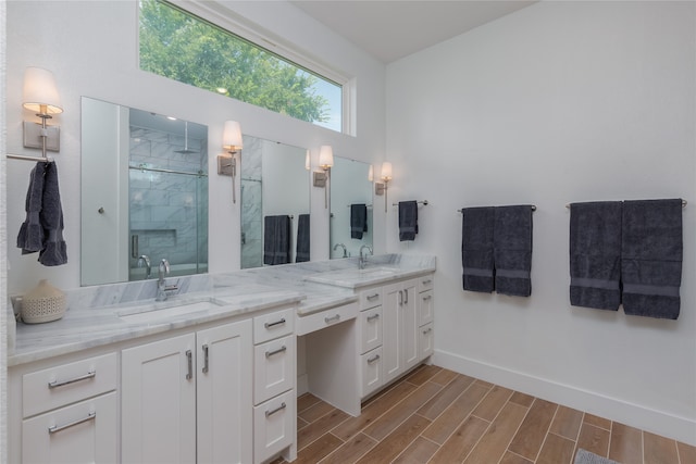 bathroom featuring vanity, a shower with shower door, and hardwood / wood-style floors