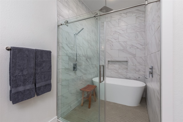 bathroom featuring tile patterned flooring, toilet, and separate shower and tub