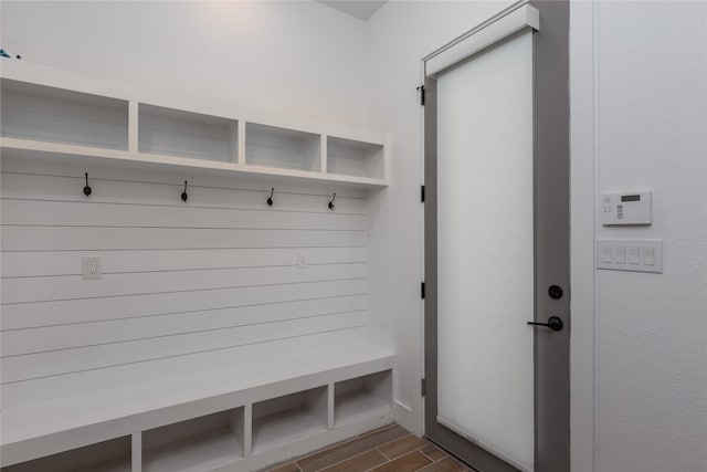 mudroom with dark hardwood / wood-style floors