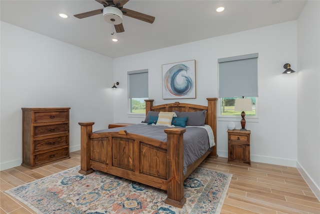 bedroom featuring light wood-type flooring and ceiling fan