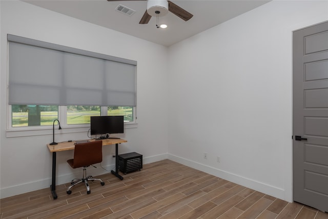 home office with ceiling fan and light wood-type flooring