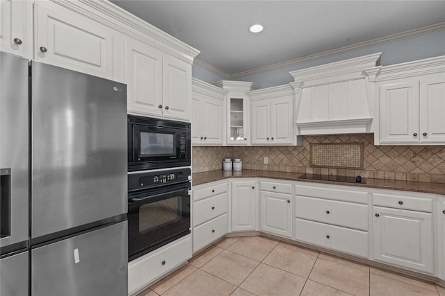 kitchen with white cabinetry, light tile patterned floors, ornamental molding, custom range hood, and black appliances