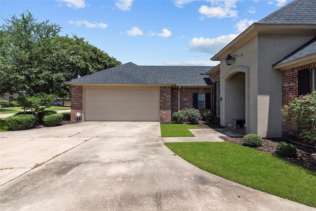 single story home with a garage and a front yard
